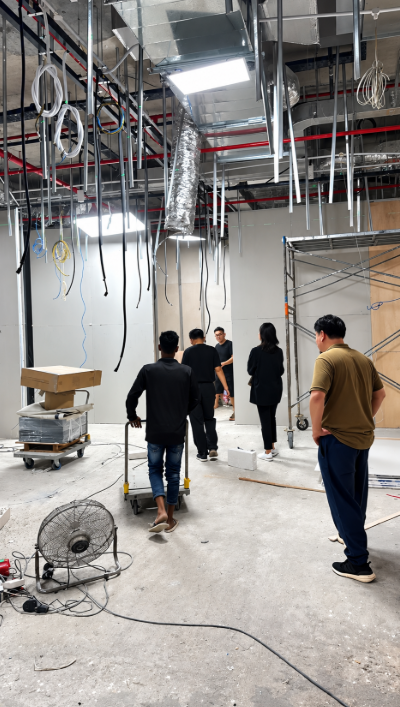 Reinstatement team working inside an unfinished commercial office